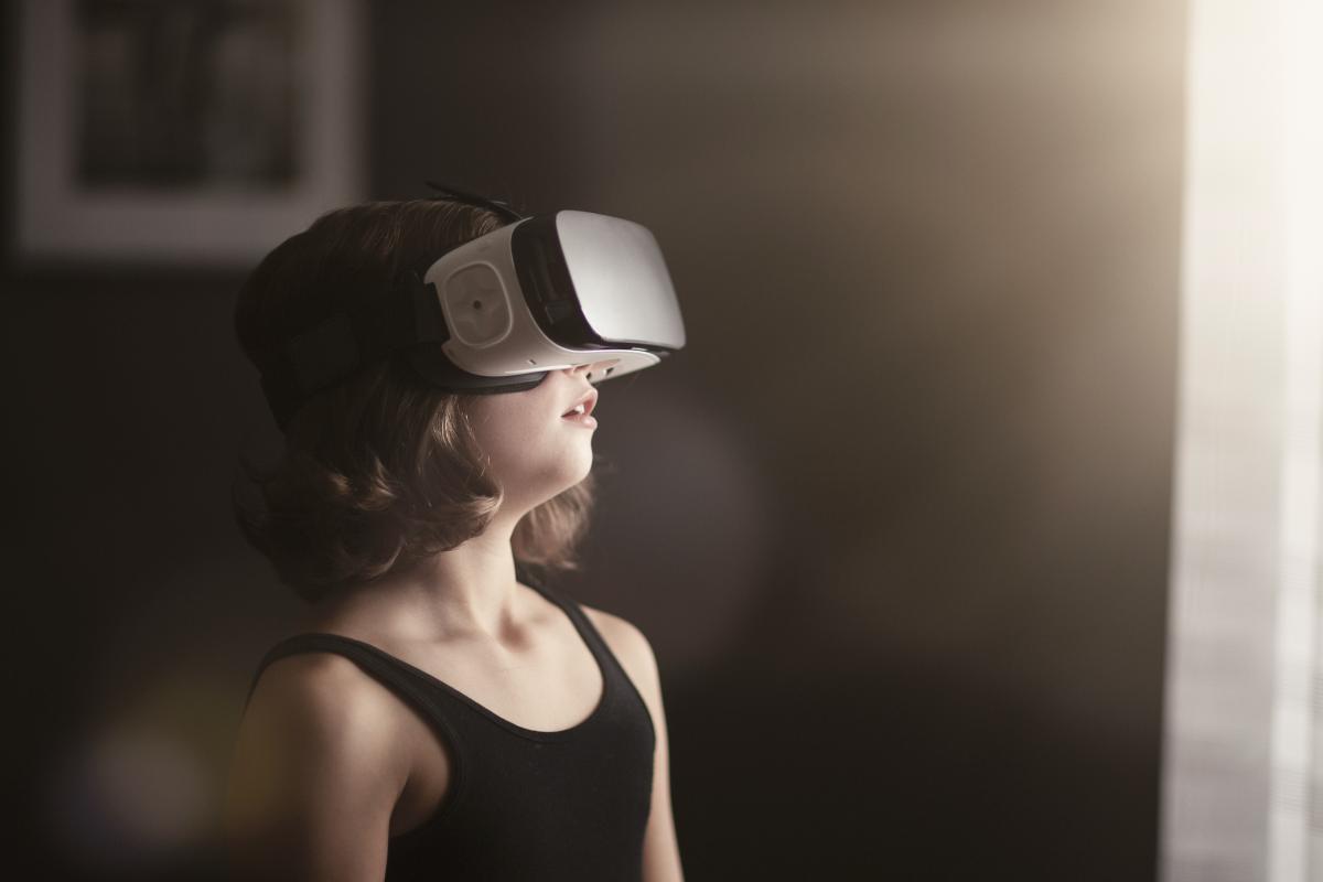 Girl looking through VR-googles