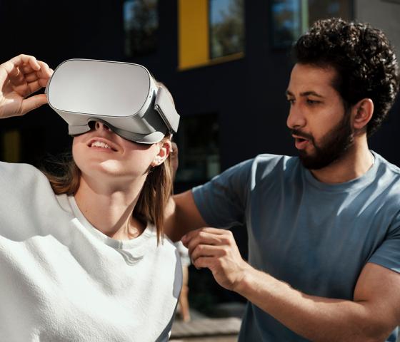 Man and woman trying VR set