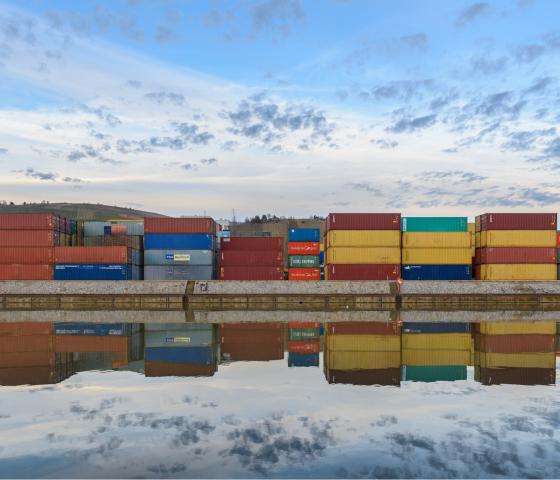 containers mirroring in water