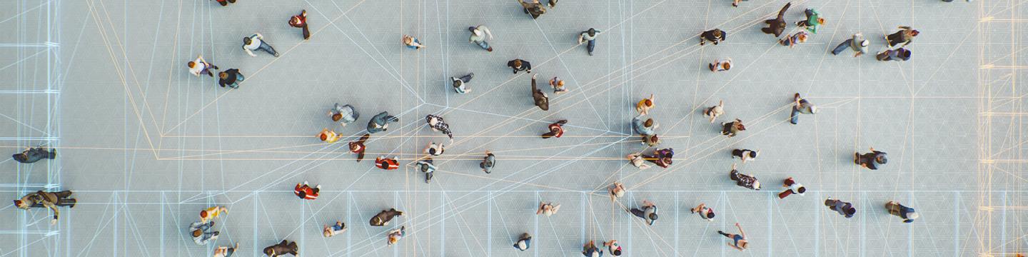 Drone perspective of a group of people connected through digital networks