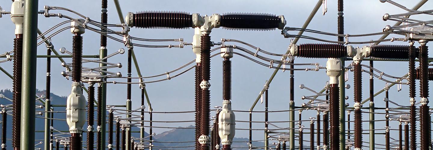 Close up of substation with mountains in the background