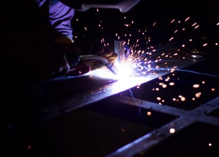 person welding  materials quality engineering