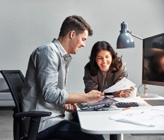 Man and woman at desk working